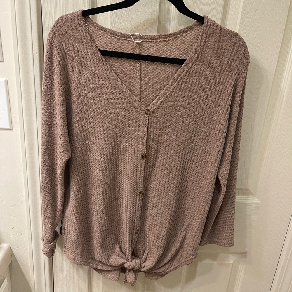 Oversized lightweight button up sweater with tie at bottom.